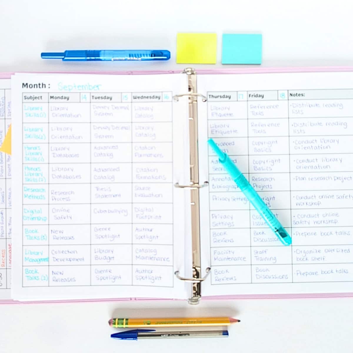 9 Prep Teacher Planner Open teacher binder on a desk. Inside is a copy of the 9 prep weekly lesson planner filled out with assignments.