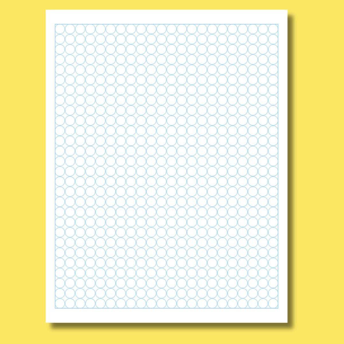 Circular dot grid graph paper print preview on a yellow background. 