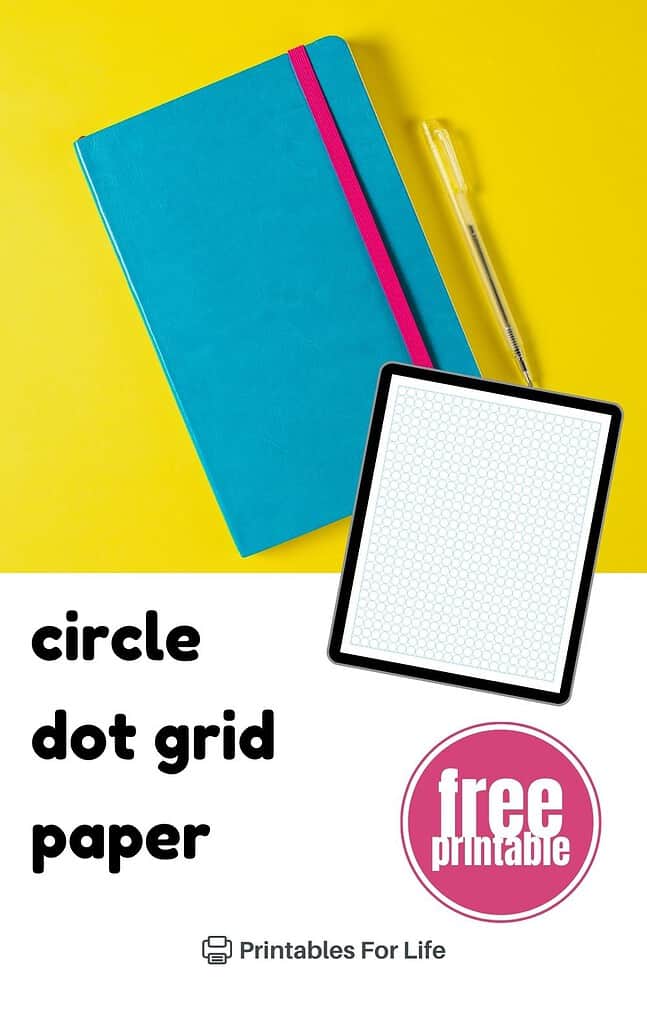 A digital tablet displaying circle dot grid paper, placed on a yellow background with a notebook and pen.