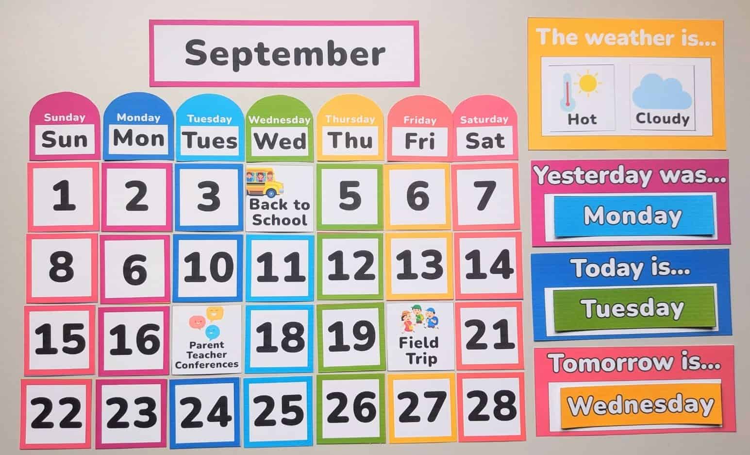 2 DIY rainbow calendar on a bulletin board.