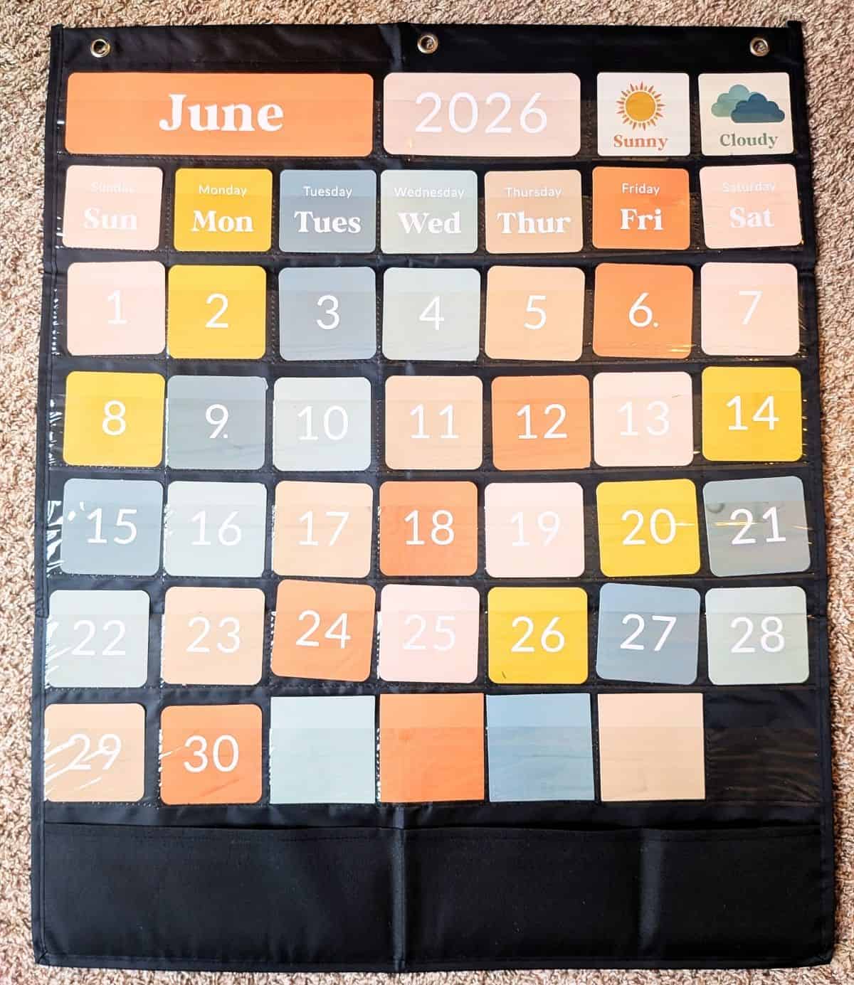 5 Pocket chart from Amazon hanging on a wall.