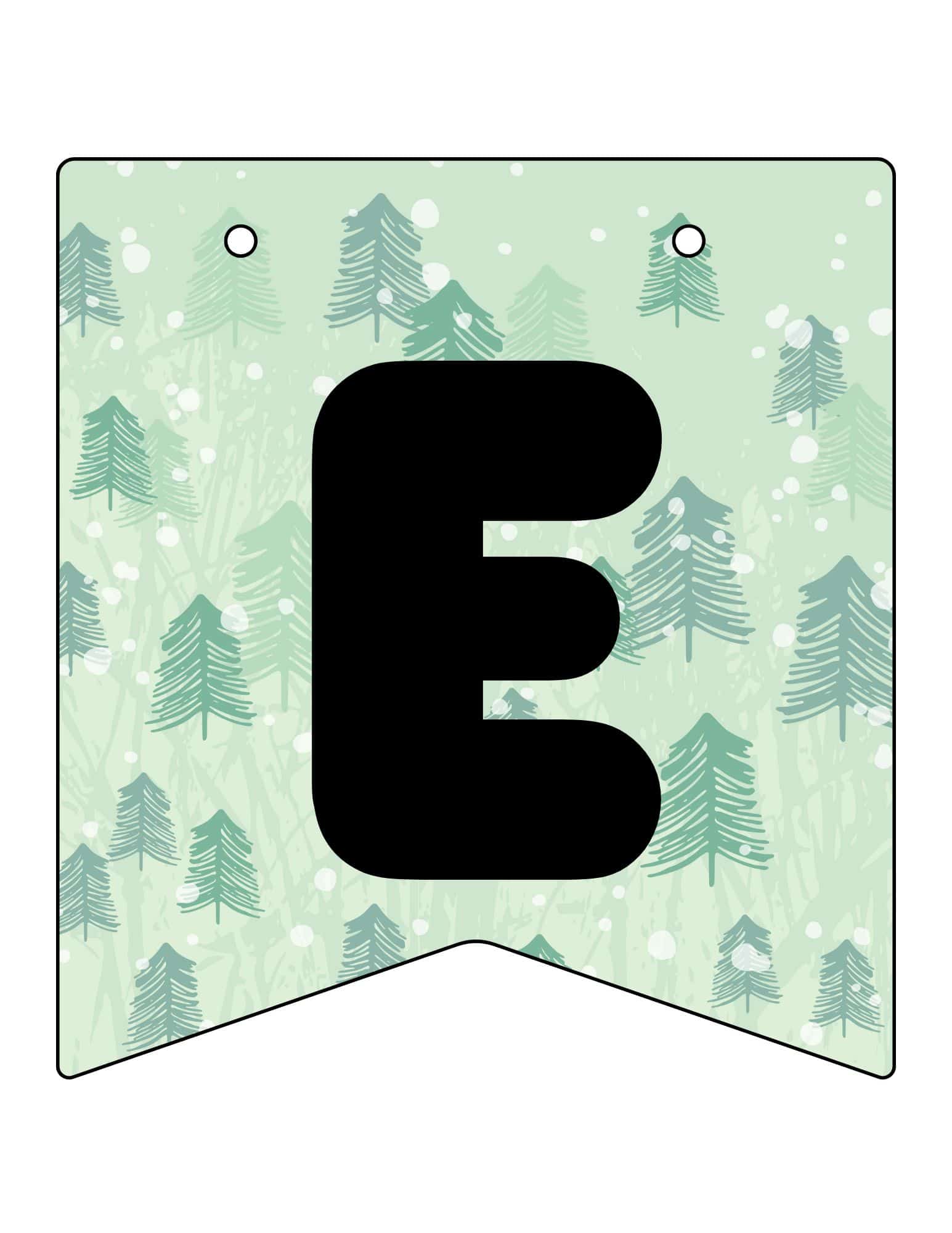 Printable Christmas banner with a bold black E on a snowy evergreen forest background.