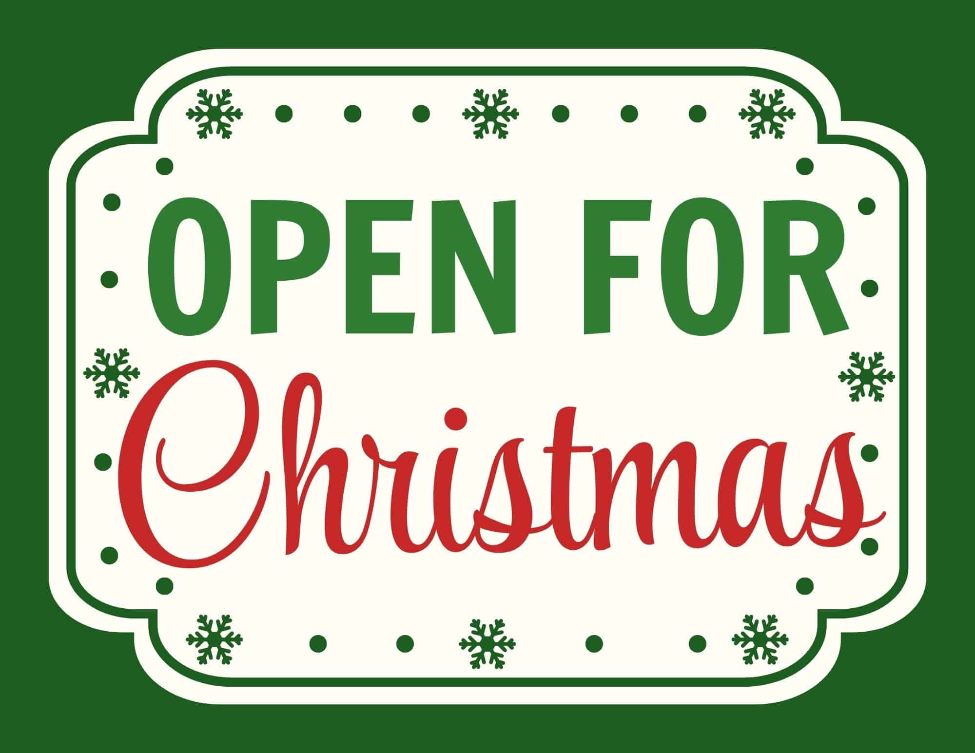 Open for Christmas sign with green, red lettering on cream background and snowflake accents.