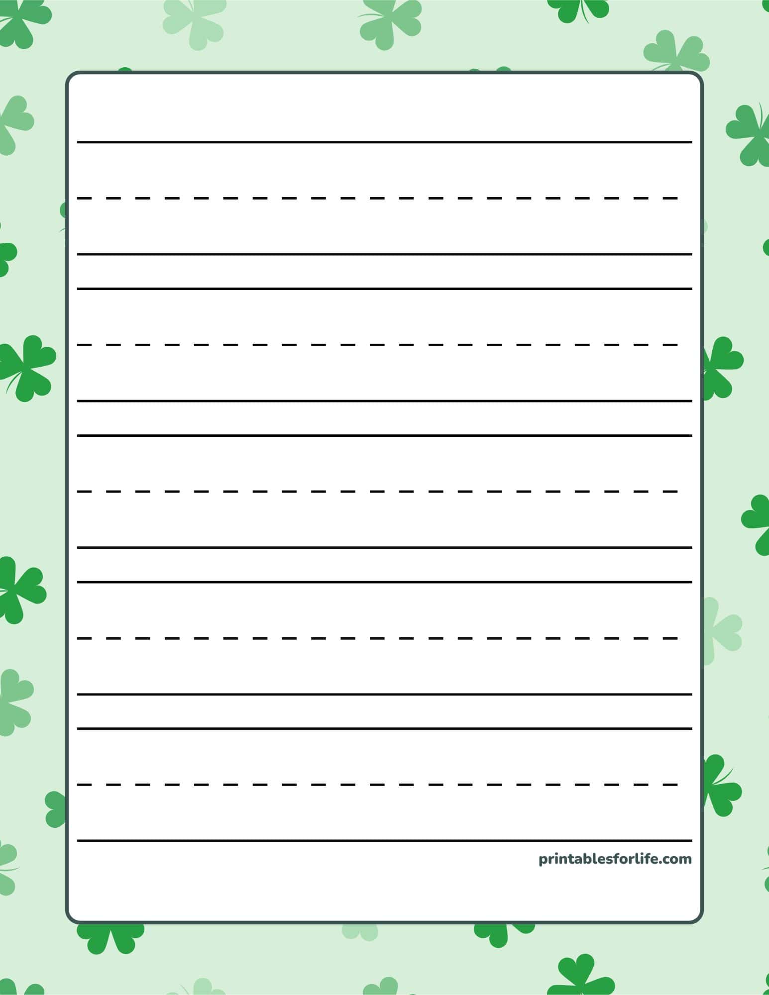 St. Patrick's Day handwriting paper with solid and dashed lines on a shamrock border.