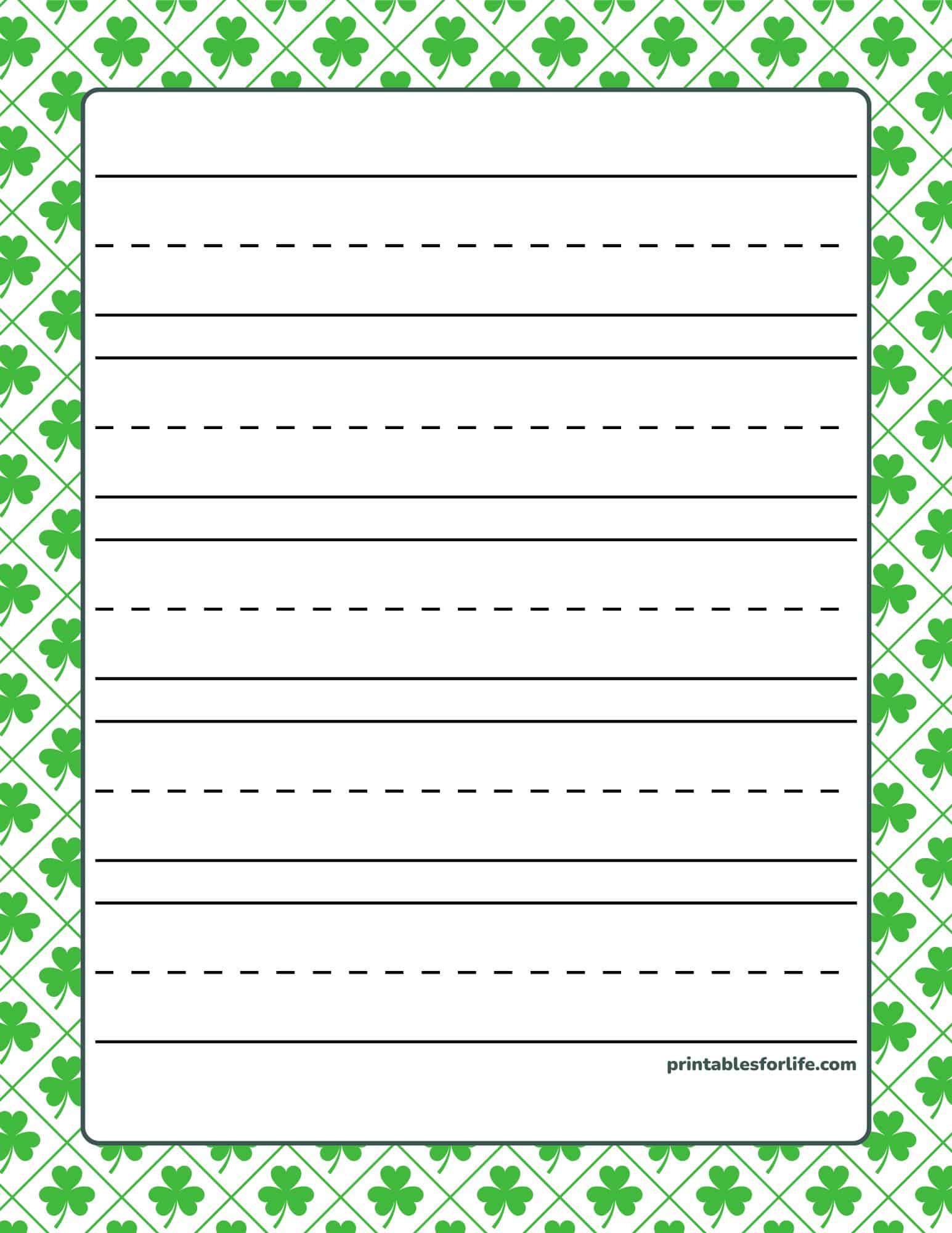 St. Patrick's Day handwriting paper with dashed and solid lines and a shamrock border.