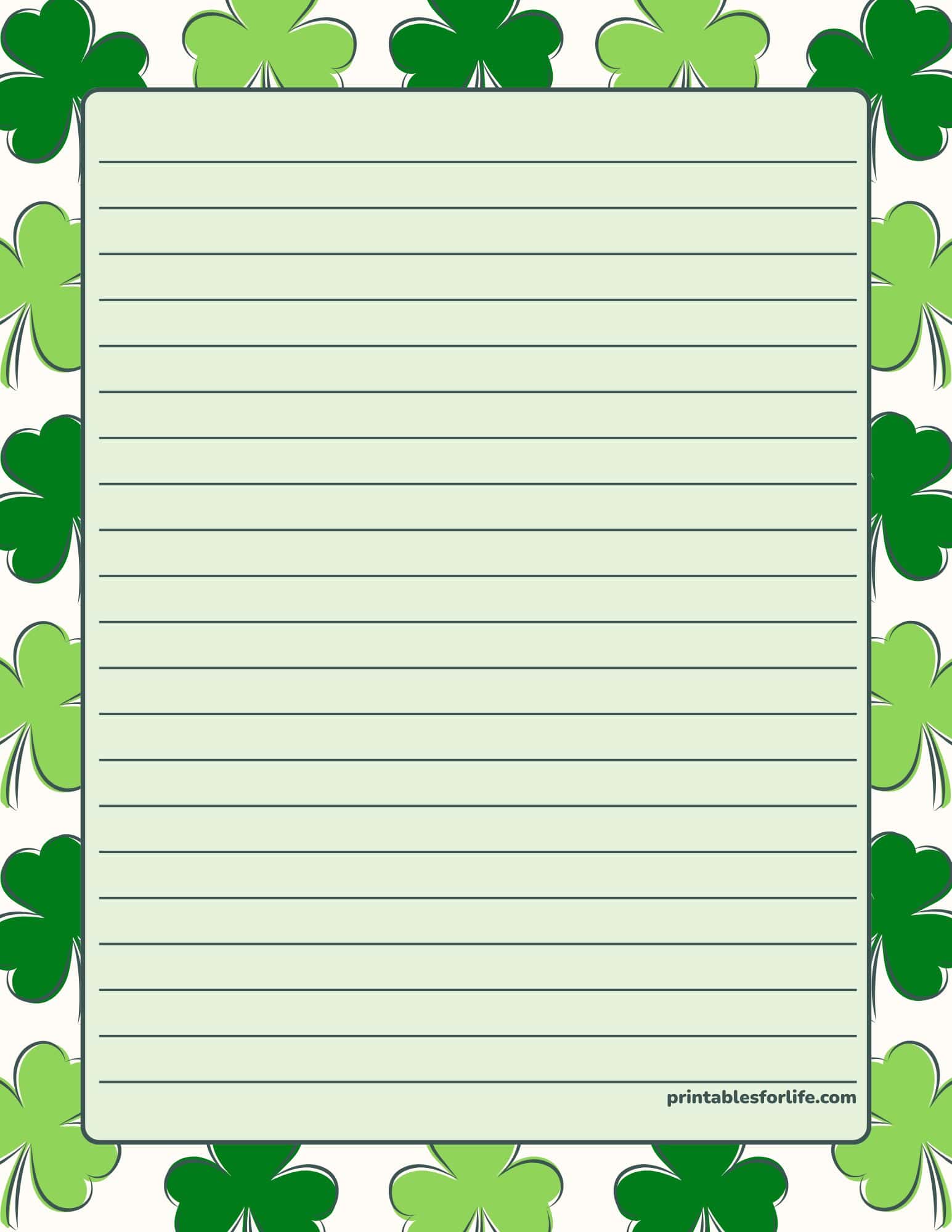 St. Patrick's Day lined paper with a shamrock border for notes — free printable stationery.